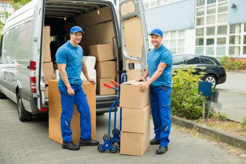 Loading furniture and boxes into a removal van in Yiewsley