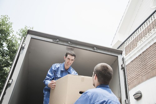 Removalists carrying furniture from a Yiewsley home