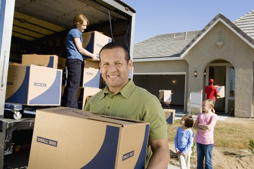 Staff using correct lifting technique during a relocation job